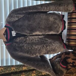 Cozy Brown Faux Fur Jacket with pockets and stripe accents